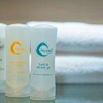 Bath & shower gel with towels in the background with the logo of Sea Crest By Jomtien Hotel in Jomtien Beach-Pattaya, Thailand. Captured by Micha Schulte Photography